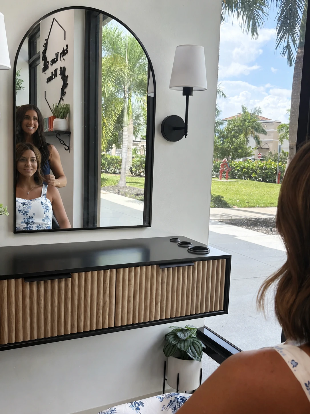 Kelly consulting with a client in her private Estero studio