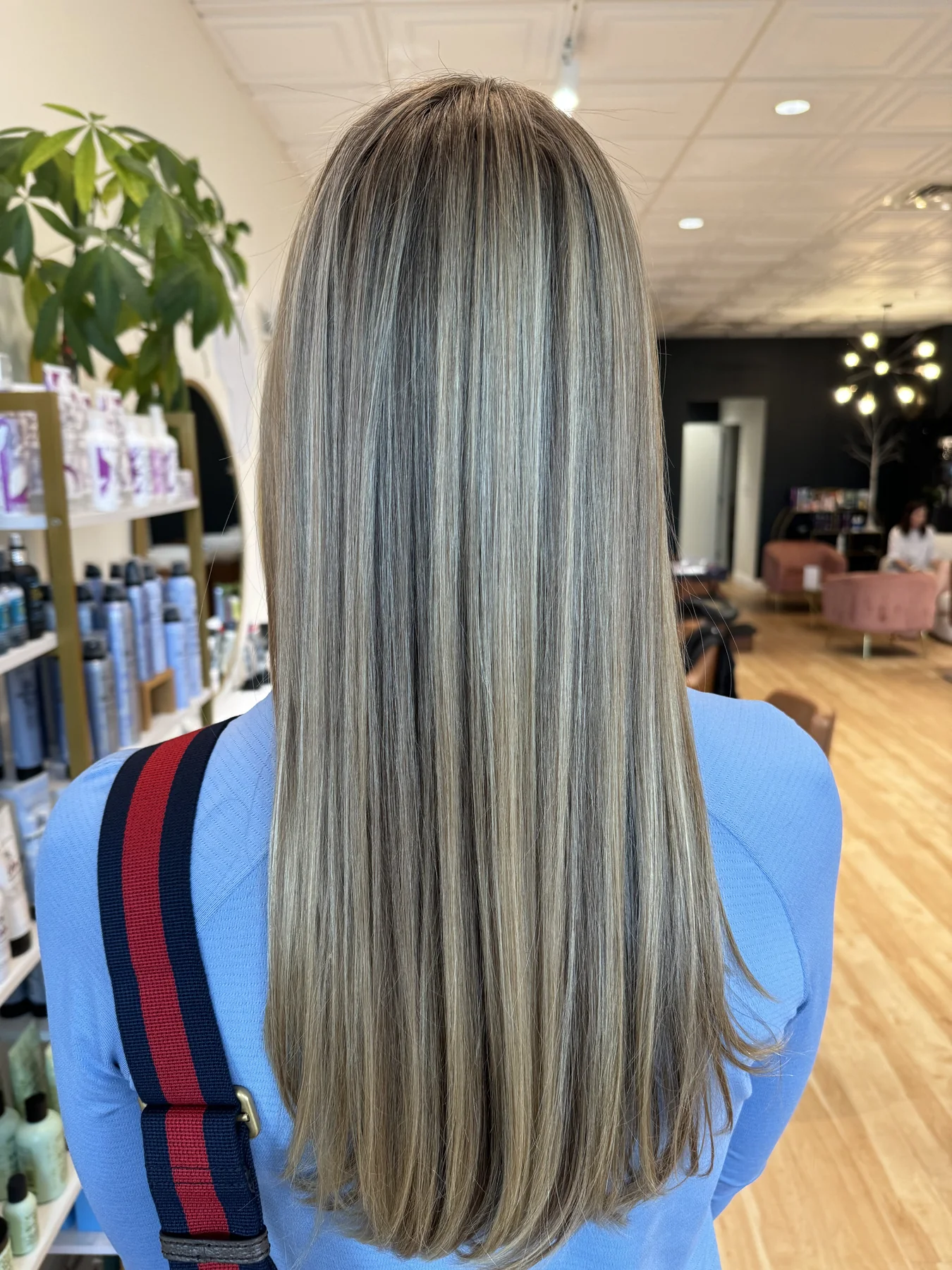 Long dimensional blonde highlights by Kelly